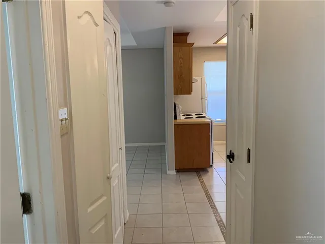 a walk in closet with a mirror