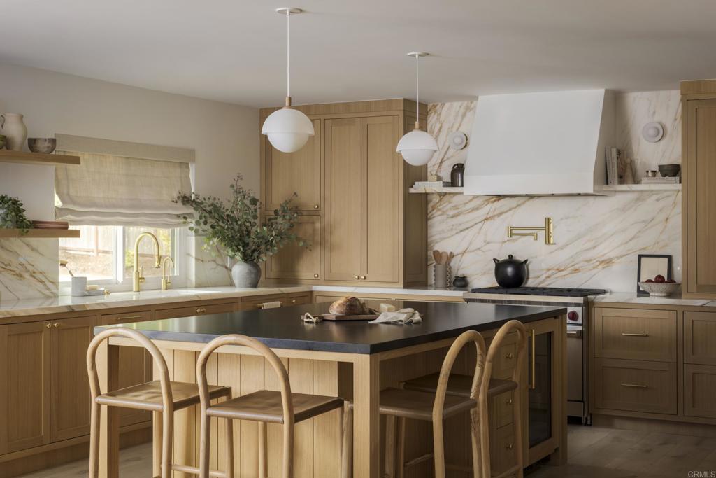 a view of a dining table and chairs in a room