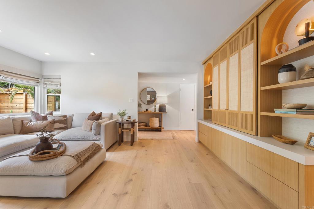 710 Edelweiss Lane Encinitas, CA 92024 - Photo 12 of 32 a living room with furniture and a large window