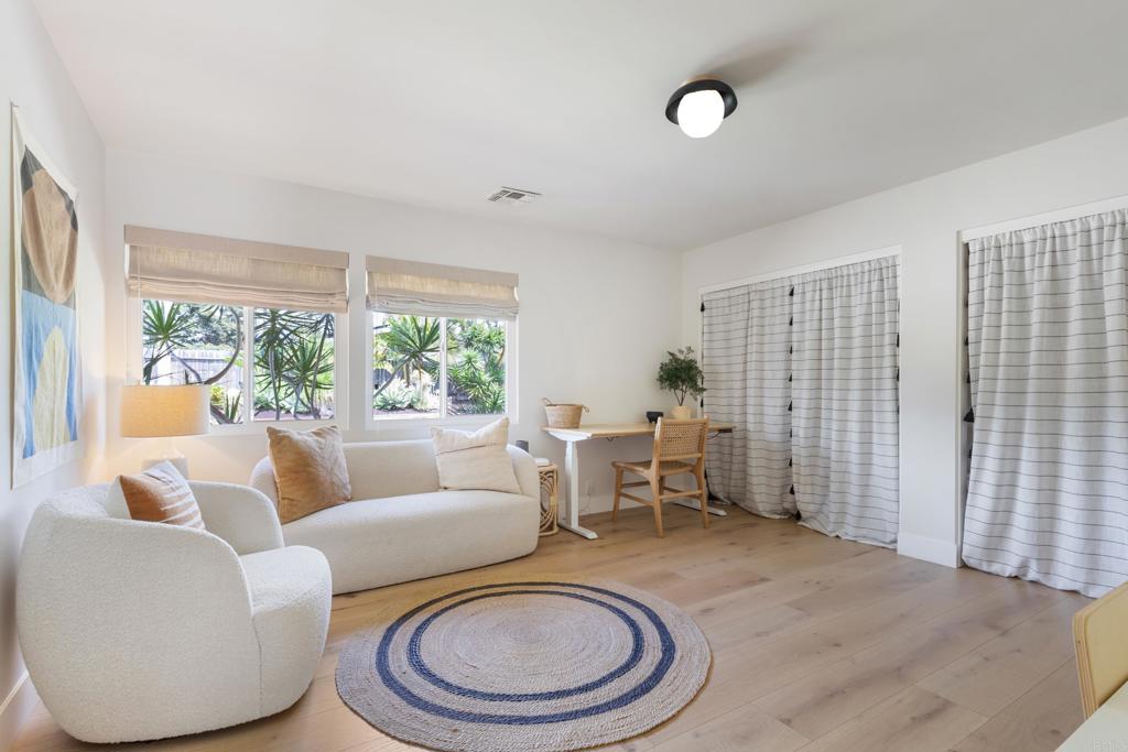 710 Edelweiss Lane Encinitas, CA 92024 - Photo 24 of 32 a living room with furniture a window and a table