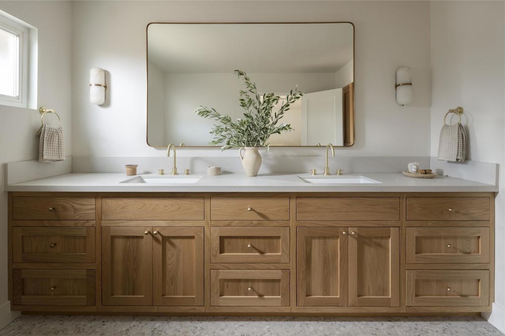 710 Edelweiss Lane Encinitas, CA 92024 - Photo 4 of 32 a bathroom with a sink and a mirror