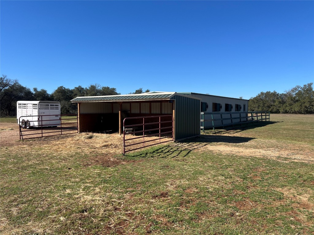 555 River Run Leander, TX 78641 - Photo 11 of 32 a view of a house with a yard and a large tree