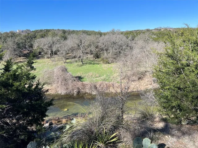 a view of lake with green space