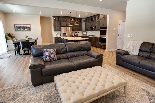 983 South 950 West Provo, UT 84601 - Photo 10 of 56 Open-concept living space featuring wood-finish flooring and recessed lighting