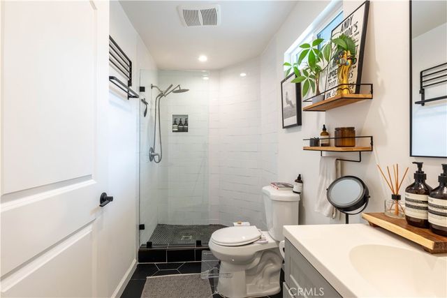 a bathroom with a sink double vanity and a mirror