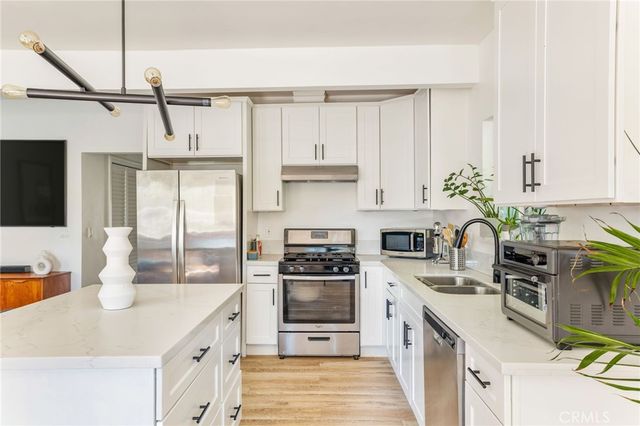 a living room with fireplace furniture and a flat screen tv