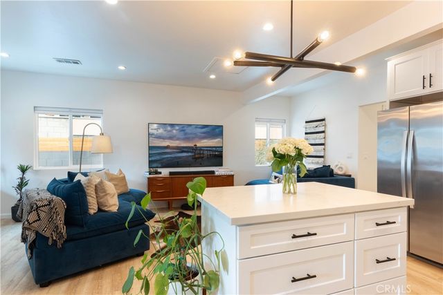a living room with furniture and a walk in closet