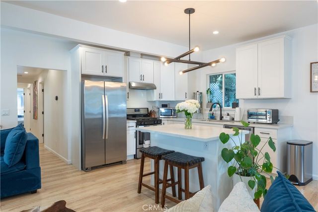 a bedroom with a large bed and a large mirror