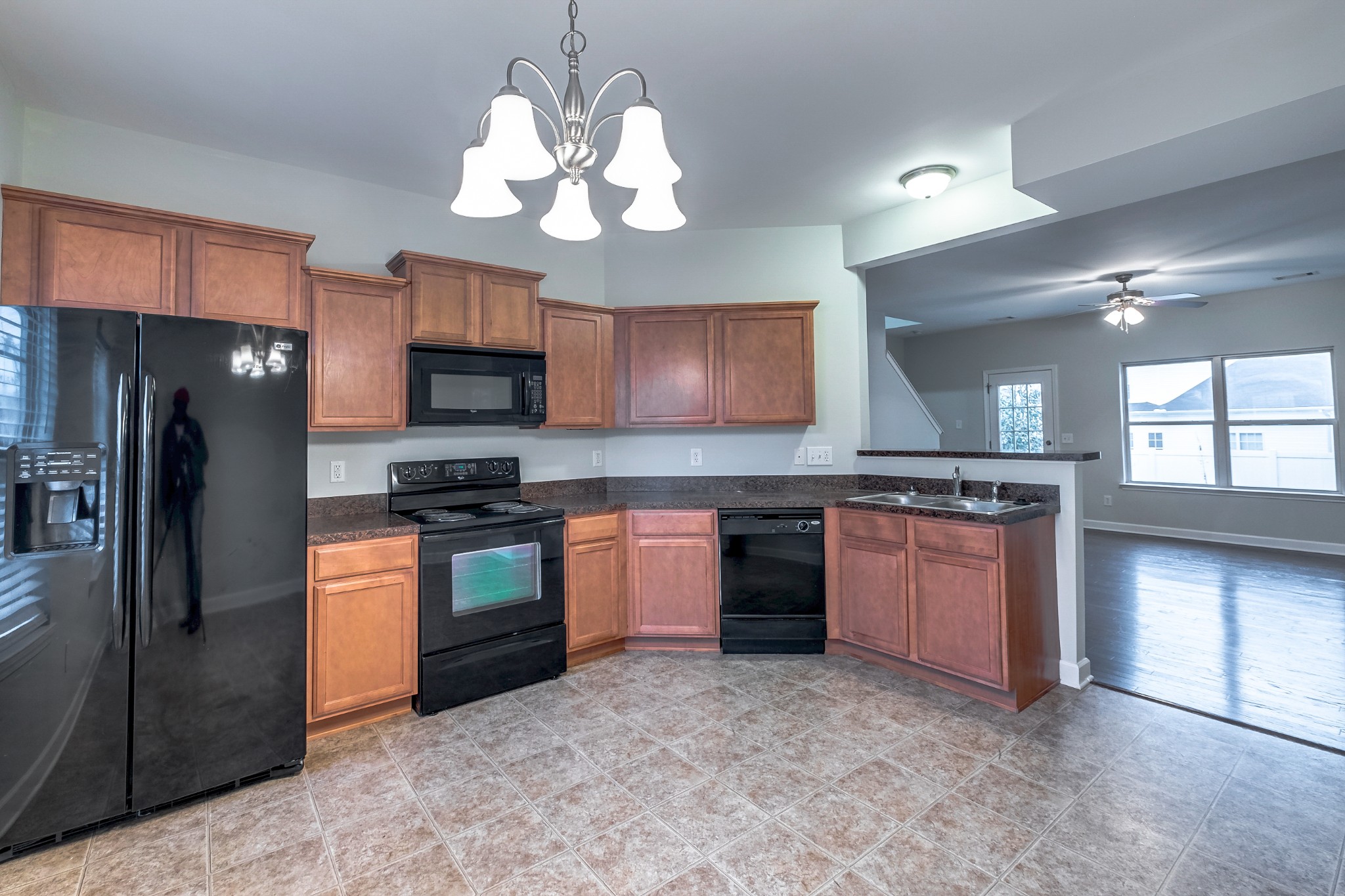 5441 Perlou Lane Murfreesboro, TN 37128 - Photo 13 of 35 a large kitchen with stainless steel appliances granite countertop a refrigerator a stove a sink and a microwave