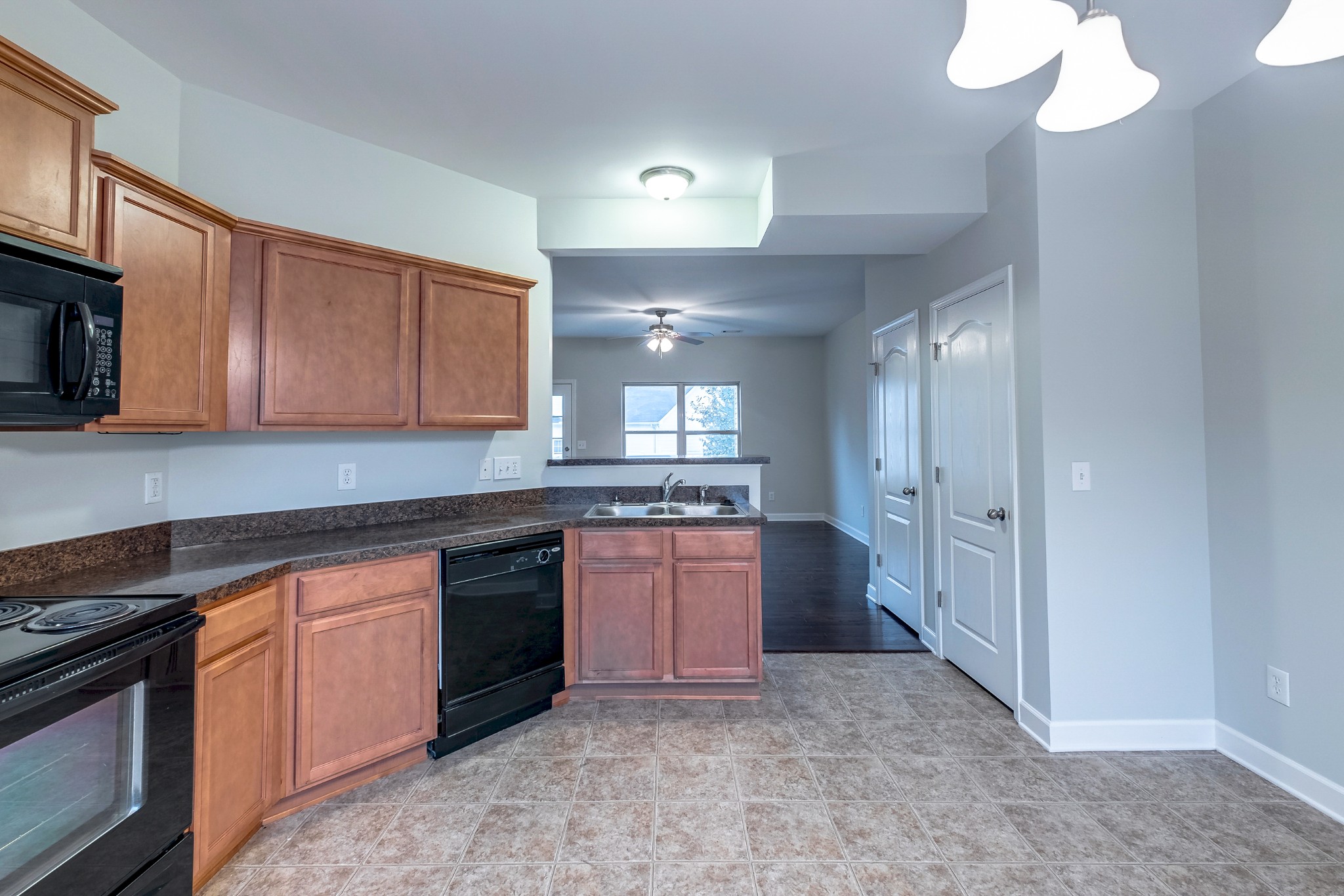 5441 Perlou Lane Murfreesboro, TN 37128 - Photo 14 of 35 a kitchen with stainless steel appliances granite countertop a stove and a sink