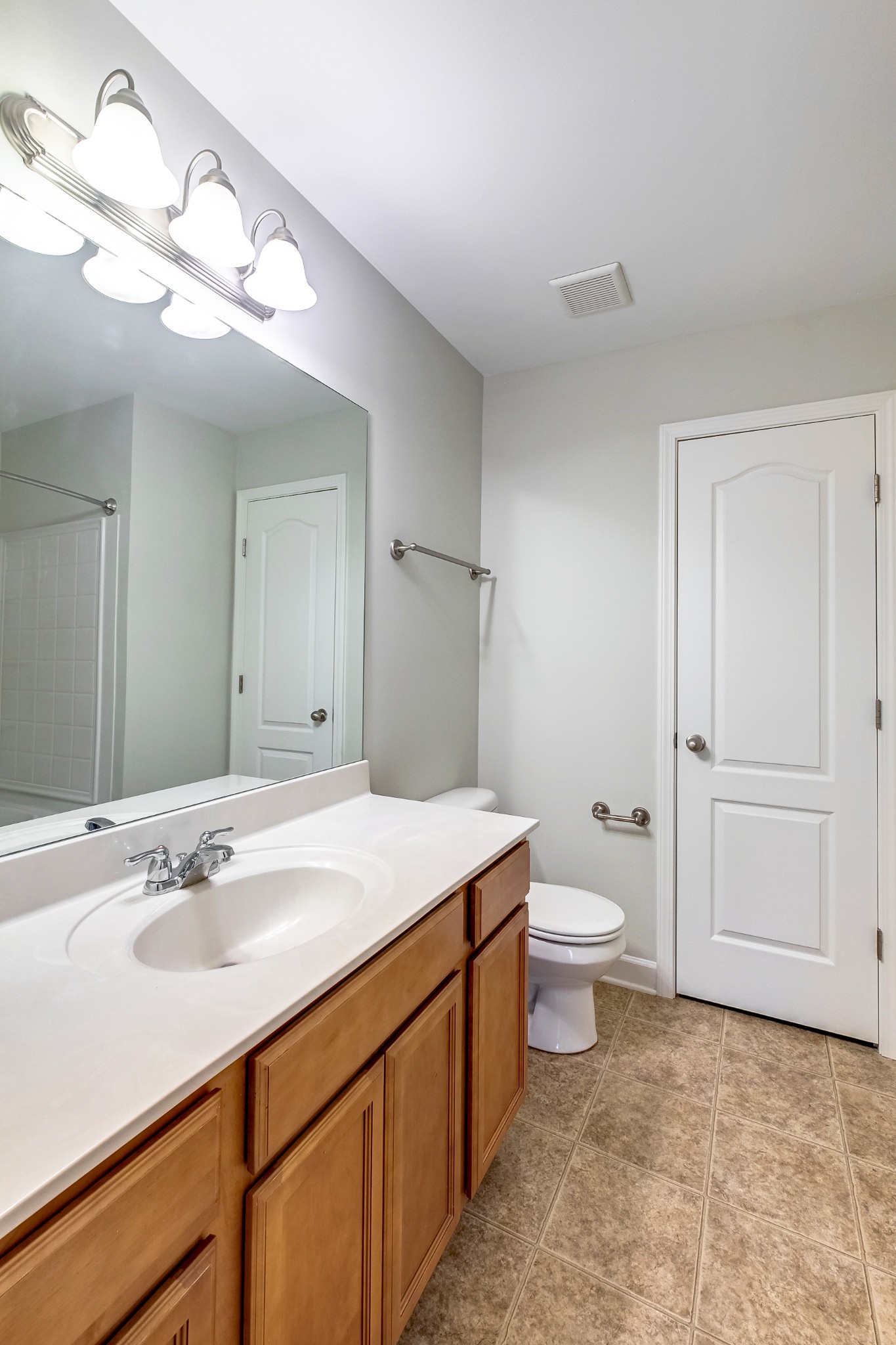 5441 Perlou Lane Murfreesboro, TN 37128 - Photo 23 of 35 a bathroom with a sink a toilet and vanity