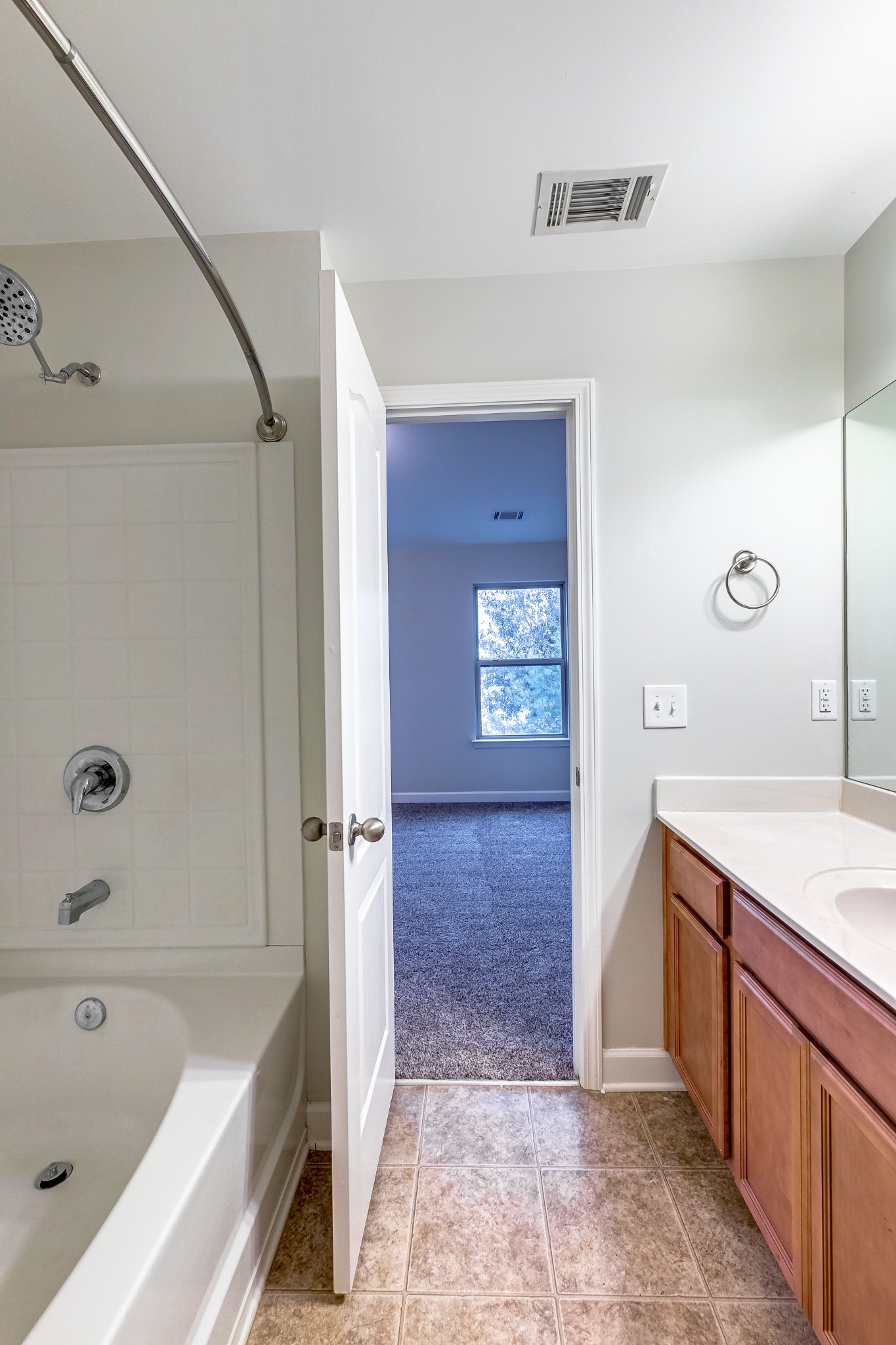 5441 Perlou Lane Murfreesboro, TN 37128 - Photo 24 of 35 a bathroom with a tub sink and mirror