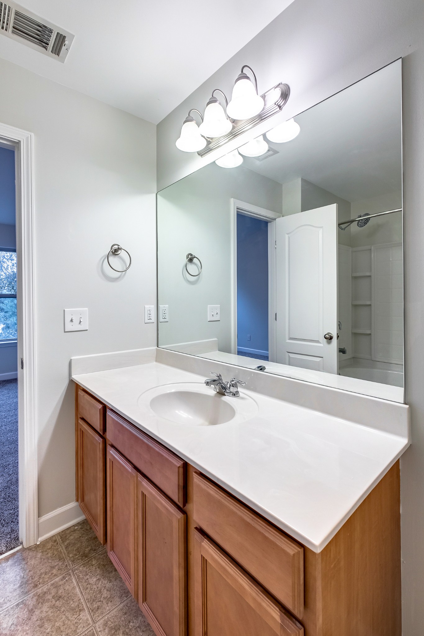 5441 Perlou Lane Murfreesboro, TN 37128 - Photo 25 of 35 a bathroom with a sink a vanity and a mirror