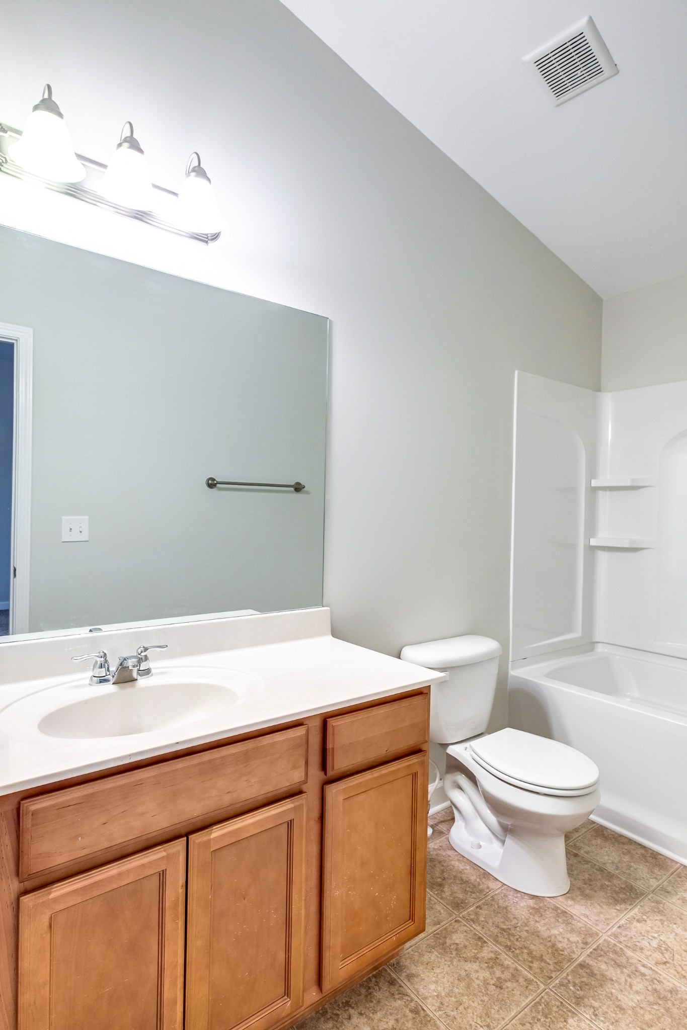 5441 Perlou Lane Murfreesboro, TN 37128 - Photo 29 of 35 a bathroom with a sink a toilet and shower