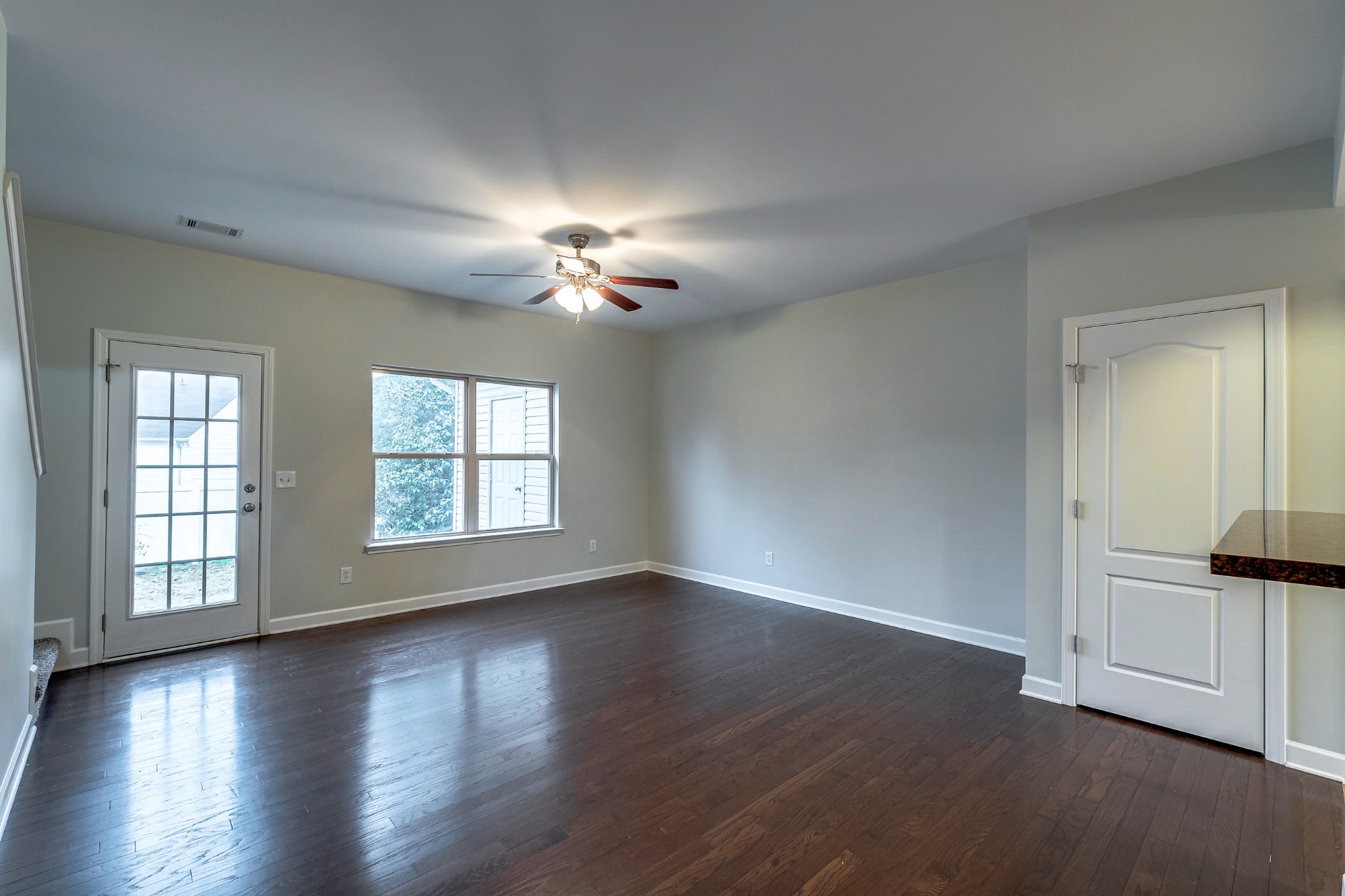 5441 Perlou Lane Murfreesboro, TN 37128 - Photo 4 of 35 a view of an empty room with wooden floor and a window