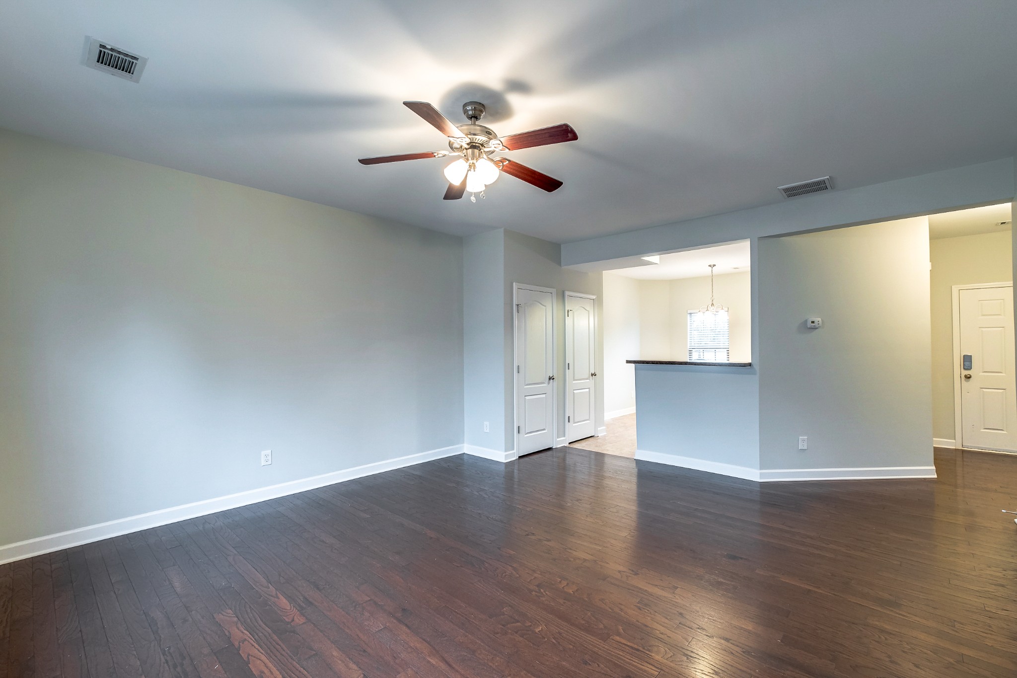 5441 Perlou Lane Murfreesboro, TN 37128 - Photo 5 of 35 a view of an empty room with wooden floor and a window