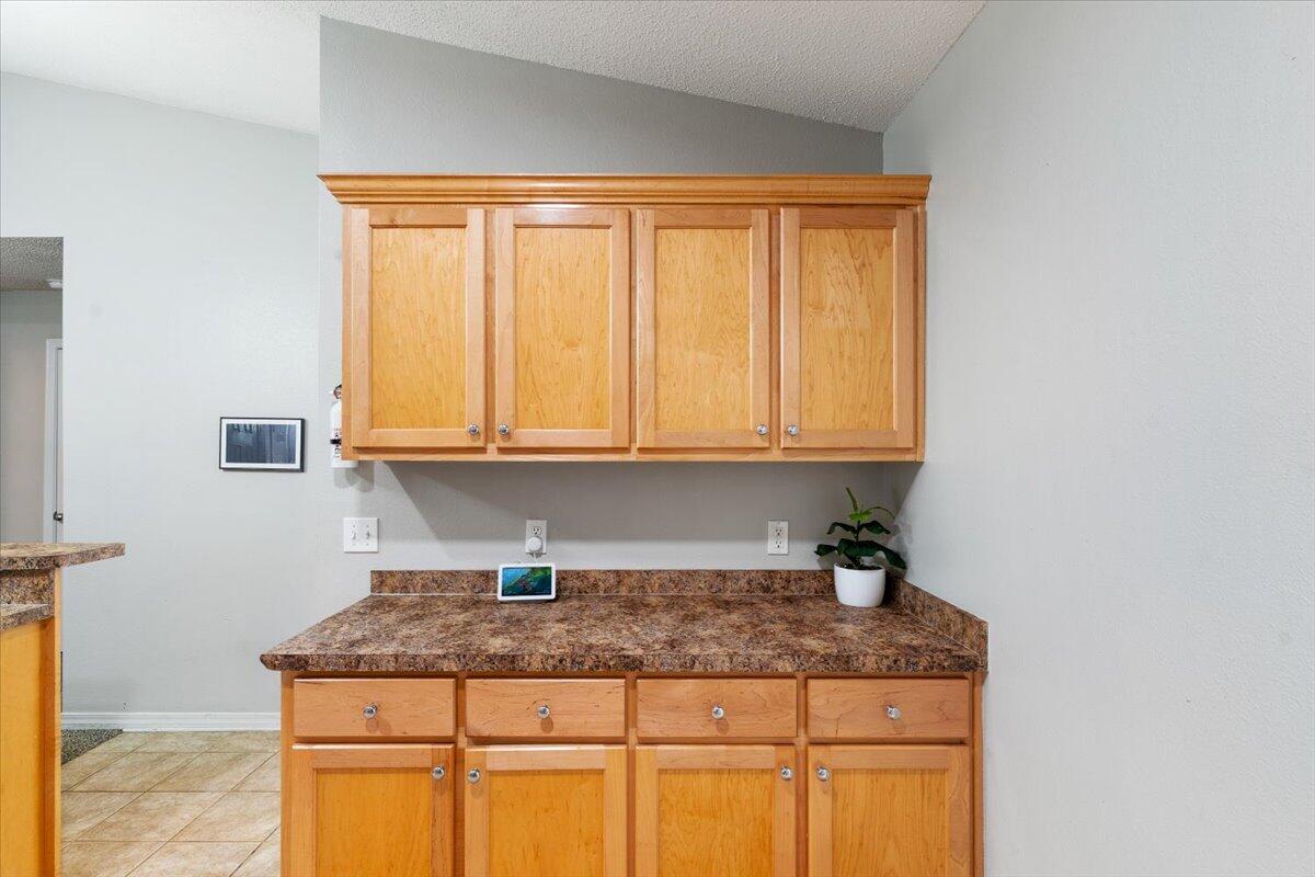 210 Citadel Lane Crestview, FL 32539 - Photo 11 of 38 a kitchen with granite countertop cabinets and window