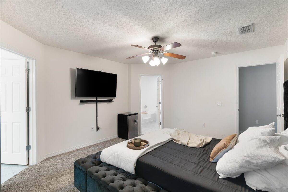 210 Citadel Lane Crestview, FL 32539 - Photo 17 of 38 a bedroom with a bed and a flat screen tv