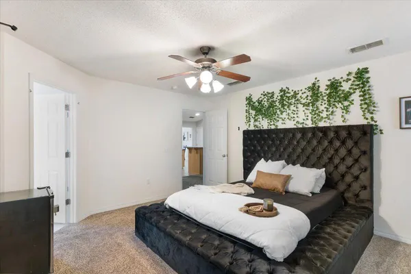 a bedroom with furniture and a window