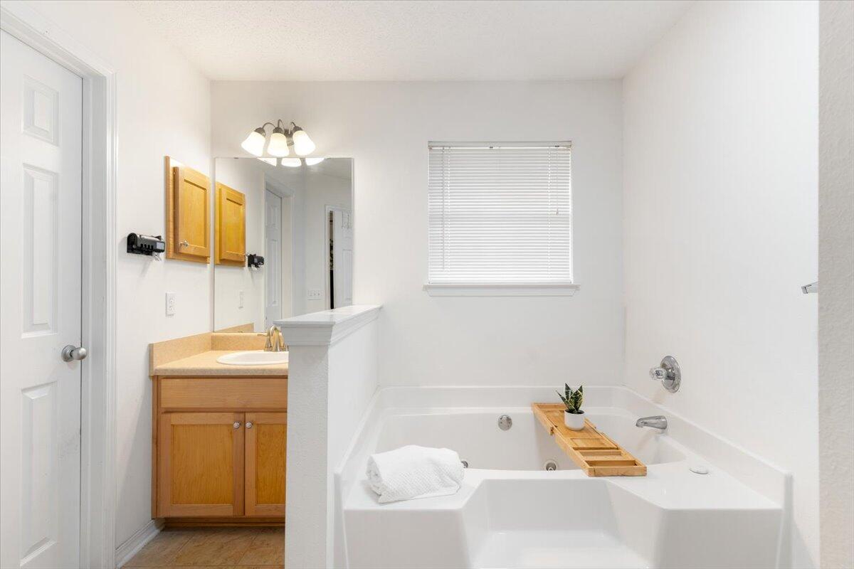 210 Citadel Lane Crestview, FL 32539 - Photo 22 of 38 a bathroom with a tub sink and mirror