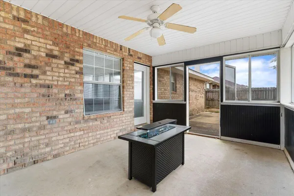 a kitchen with stainless steel appliances kitchen island granite countertop a refrigerator and a stove