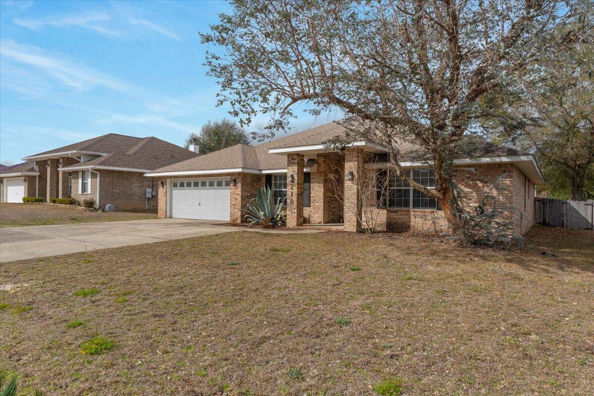 210 Citadel Lane Crestview, FL 32539 - Photo 5 of 38 a front view of a house with a yard
