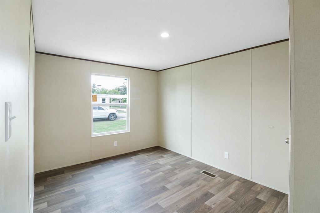 708 West 8th Street Coleman, TX 76834 - Photo 22 of 25 a view of an empty room with a window