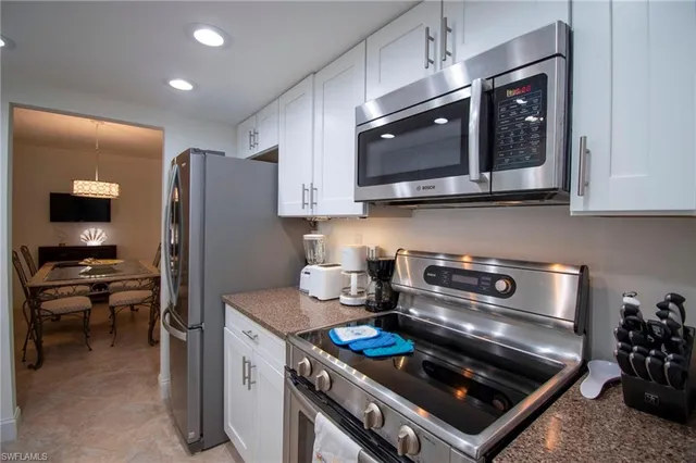 a kitchen with a stove and a microwave
