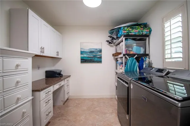 a kitchen with stainless steel appliances granite countertop a sink stove and window
