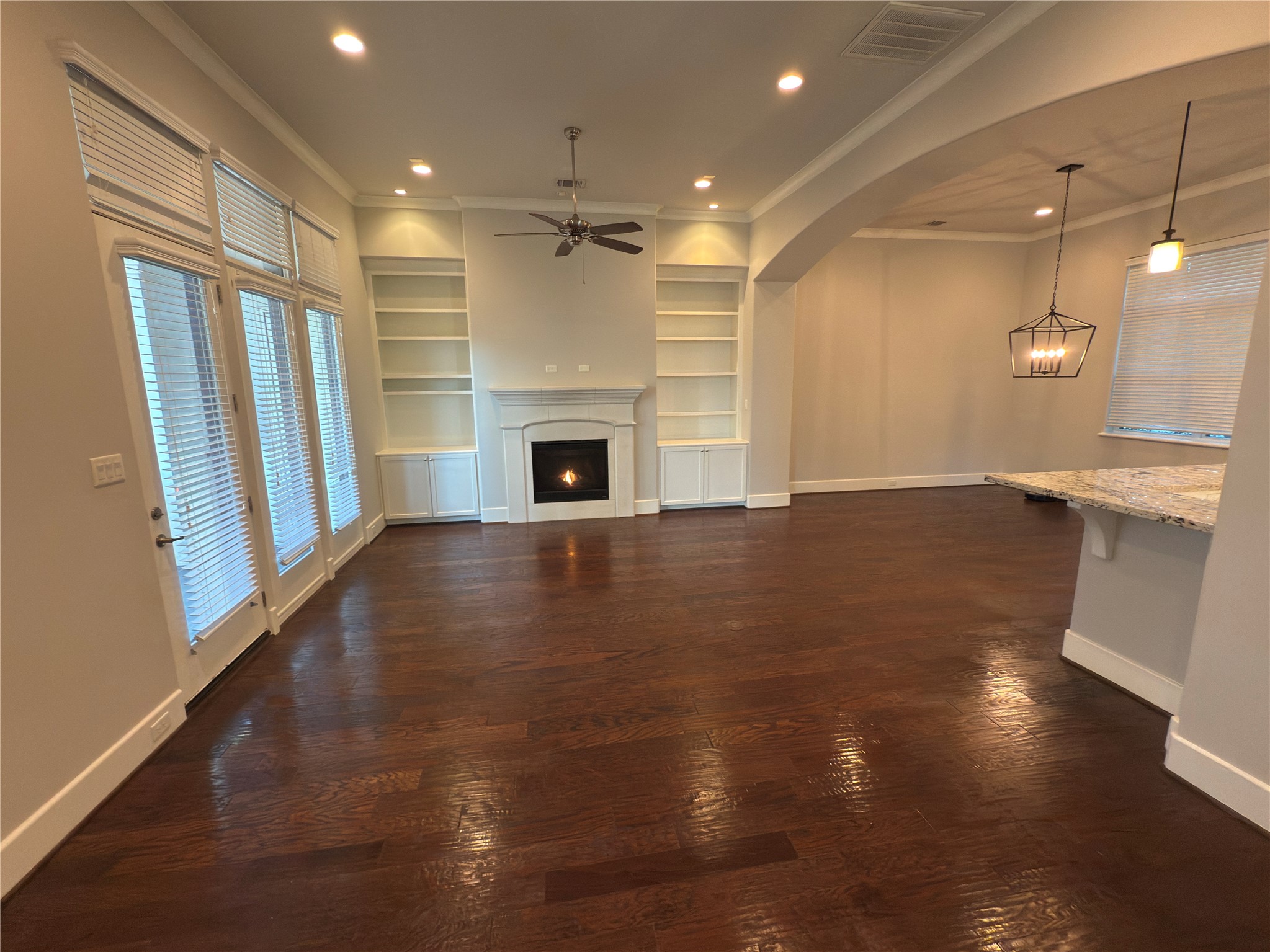 5640 Larkin Street Houston, TX 77007 - Photo 11 of 36 a view of empty room with wooden floor and fireplace