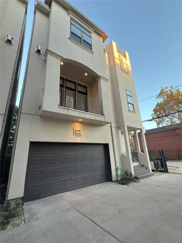 a front view of a house with garage
