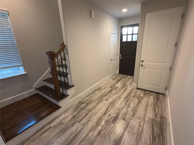 a bathroom with a granite countertop sink a toilet and shower
