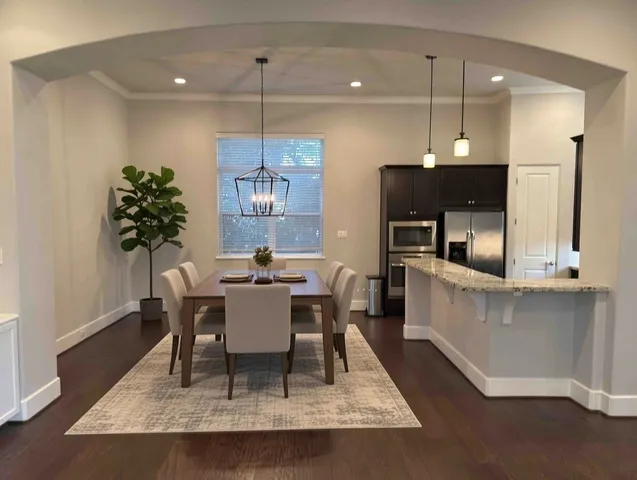 a view of a dining room with furniture