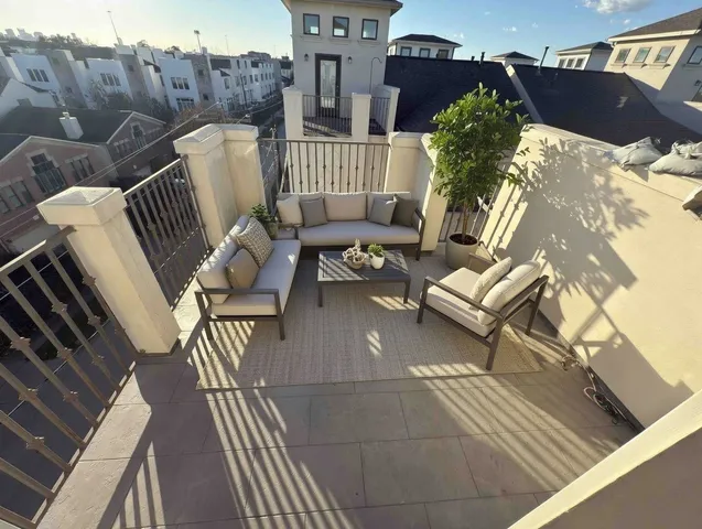 a view of a balcony with furniture