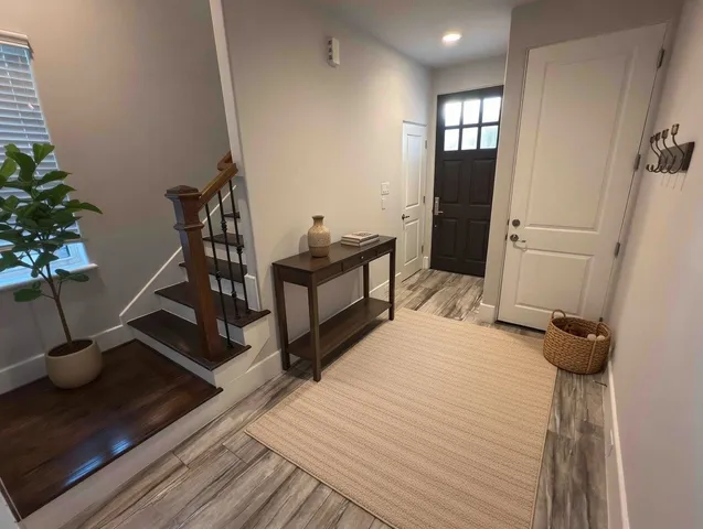 a bedroom with a bed and a potted plant