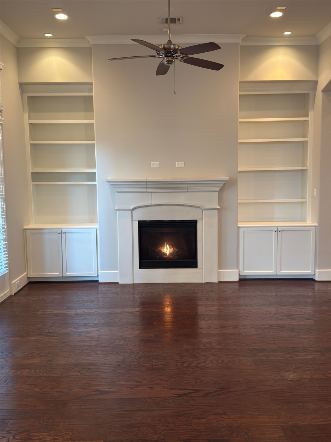 5640 Larkin Street Houston, TX 77007 - Photo 10 of 36 a view of an empty room with a fireplace and a window