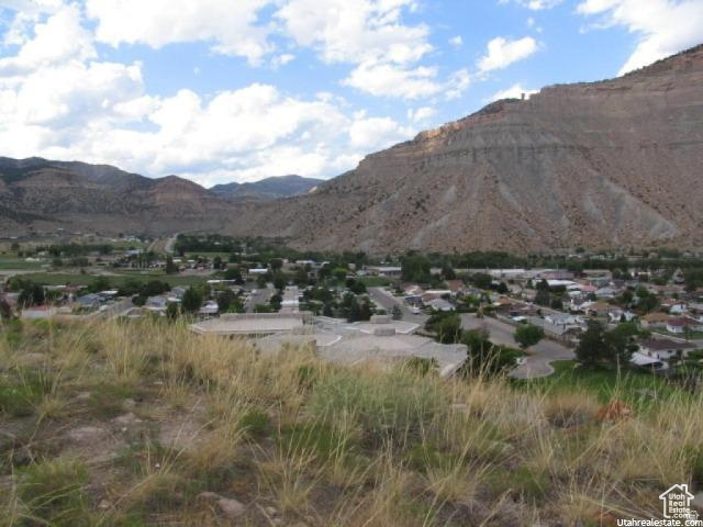 700 Spring Canyon Road Helper, UT 84526 - Photo 16 of 19 Expansive mountain landscape featuring a valley town with residential structures and established infrastructure