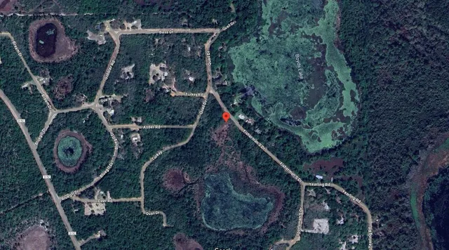 a view of a backyard of a house