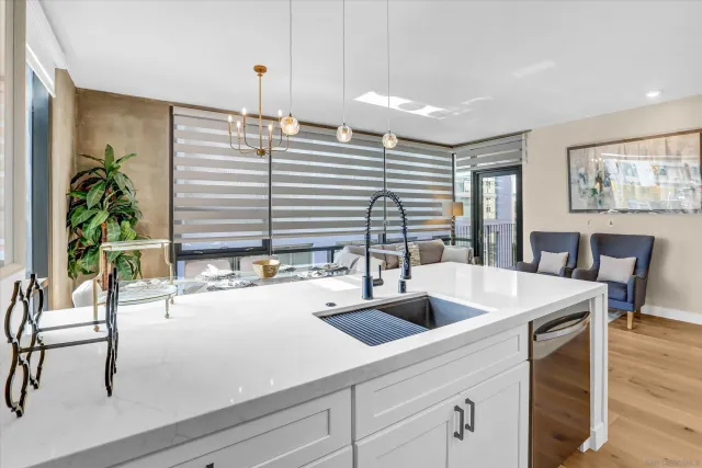 a kitchen with a table chairs and a window
