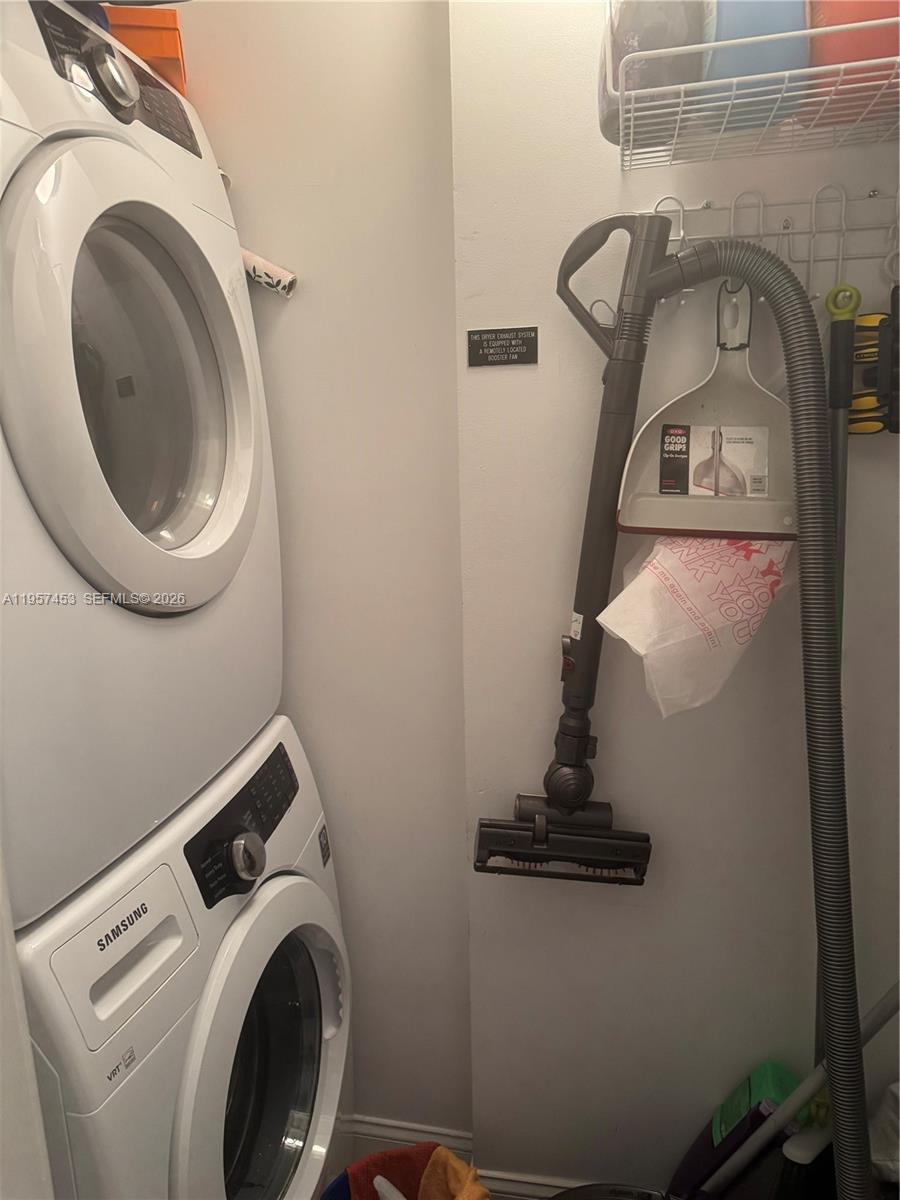 1050 Brickell Avenue, Unit 818 Miami, FL 33131 - Photo 18 of 19 a close view of a utility room with dryer and washer