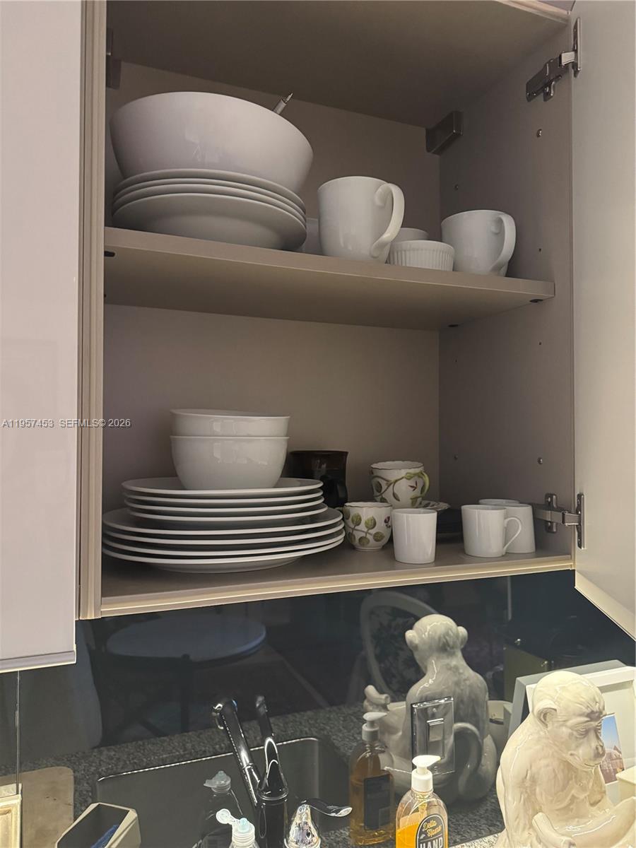 1050 Brickell Avenue, Unit 818 Miami, FL 33131 - Photo 8 of 19 a close view of flowerpot and dining table