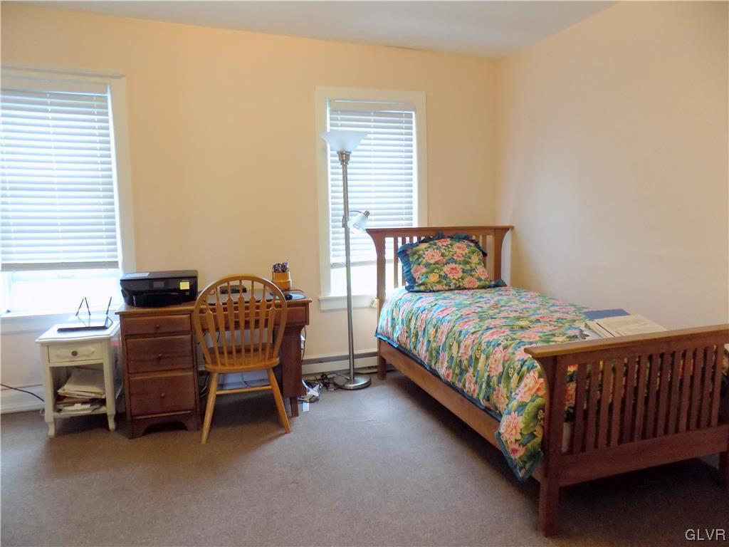 502 Atlas Road Northampton, PA 18067 - Photo 11 of 18 a bedroom with a bed and a table chair