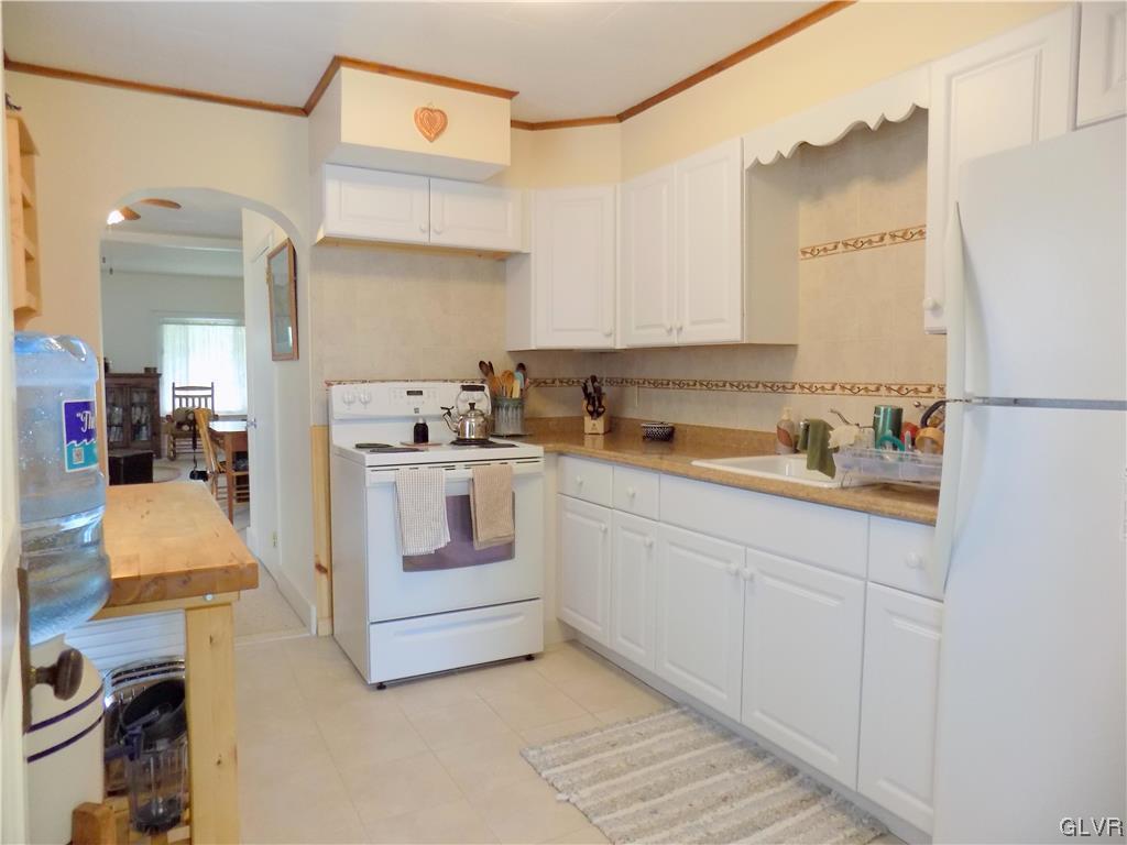 502 Atlas Road Northampton, PA 18067 - Photo 6 of 18 a kitchen with cabinets stainless steel appliances and a counter