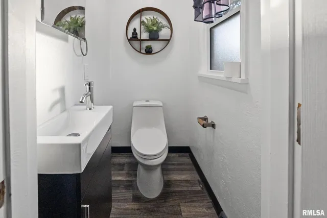 a bathroom with a toilet and a sink