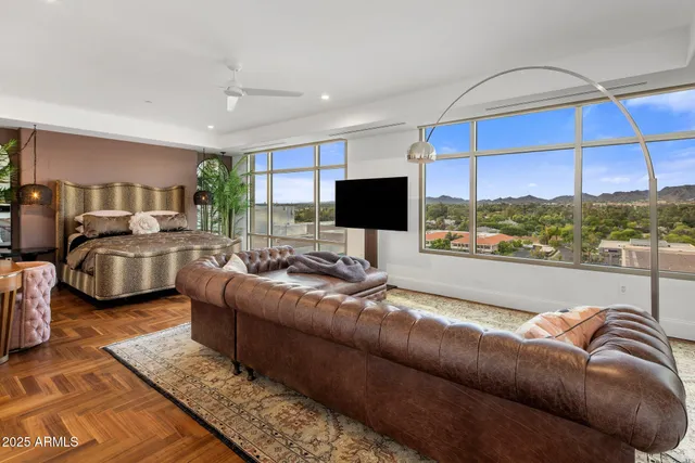 a living room with furniture window and a flat screen tv