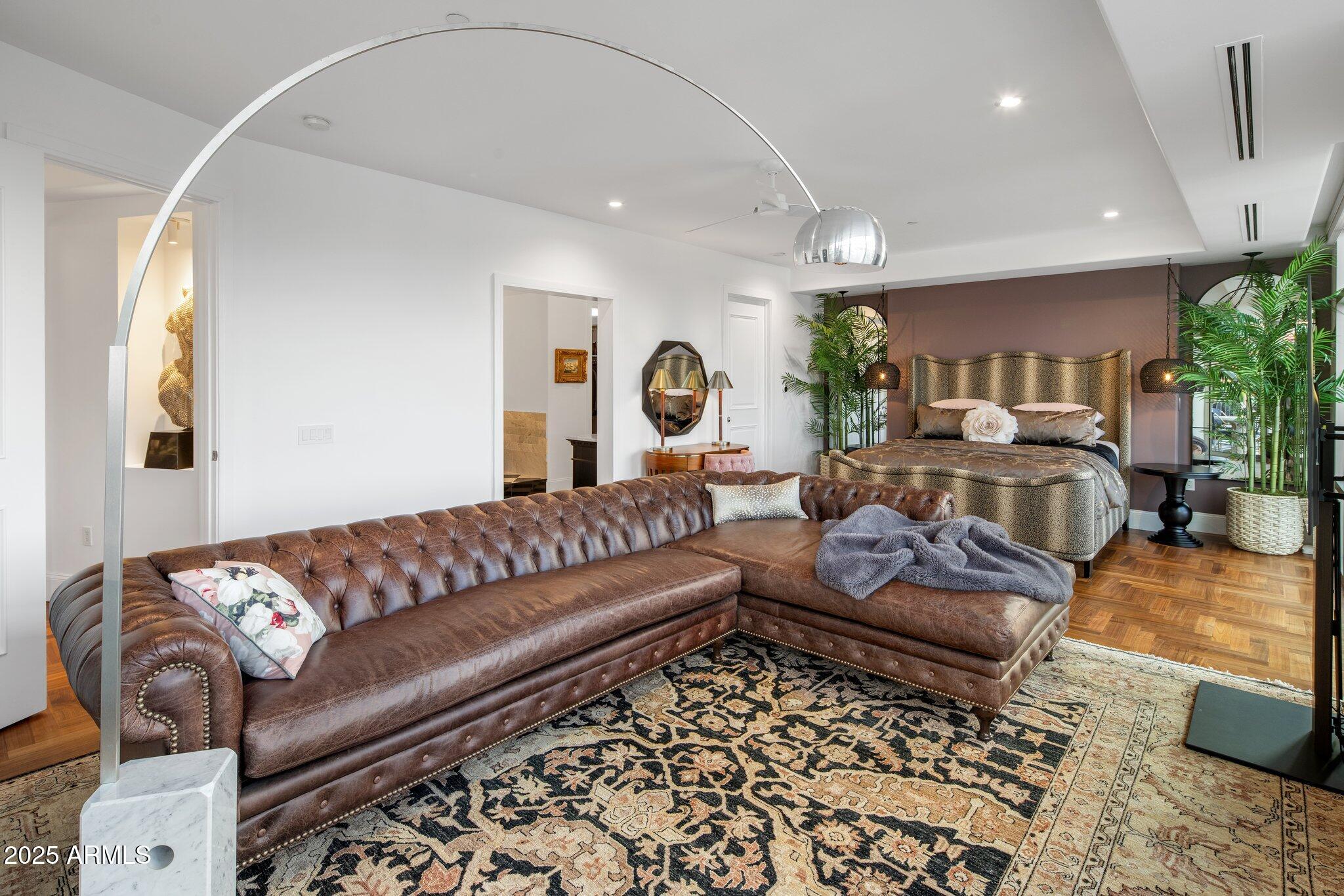 2211 East Camelback Road, Unit 902 Phoenix, AZ 85016 - Photo 17 of 37 a living room with furniture and a large window