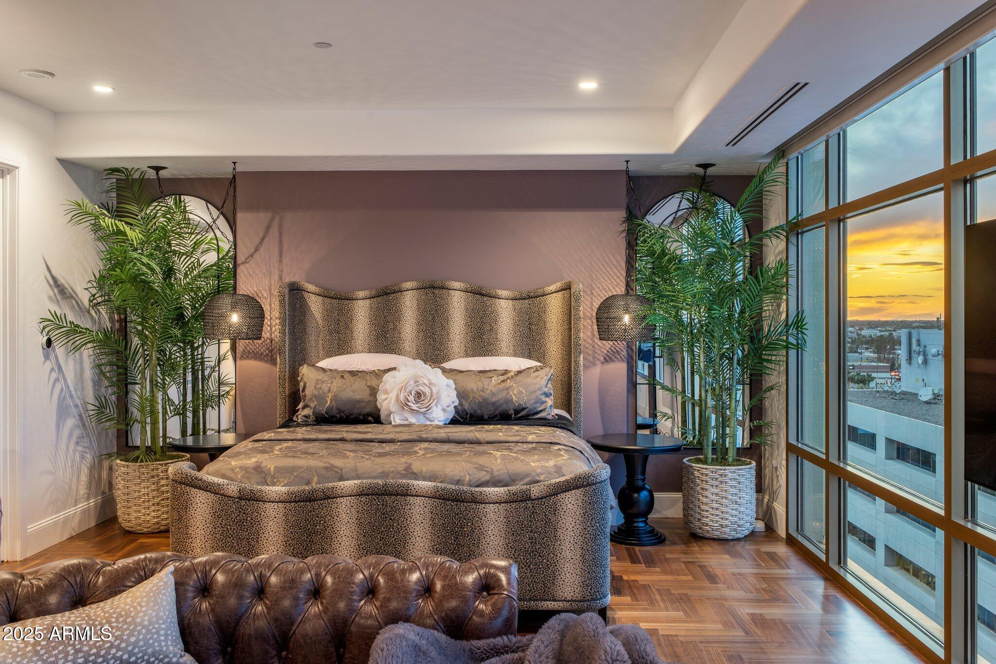 2211 East Camelback Road, Unit 902 Phoenix, AZ 85016 - Photo 20 of 37 a room with furniture and potted plants