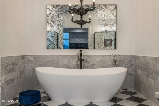 a white bath tub sitting in a bathroom