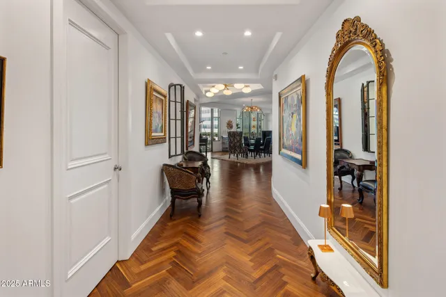 a lobby with furniture and a glass door