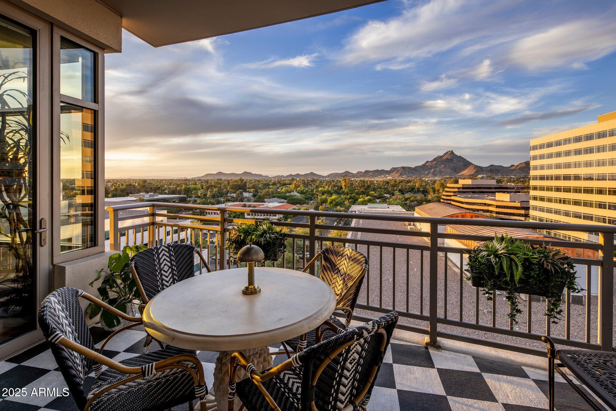 2211 East Camelback Road, Unit 902 Phoenix, AZ 85016 - Photo 34 of 37 a view of a chairs and table in the balcony